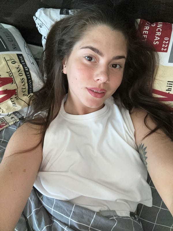 Woman rests in bed with unicorn plush in Reutov