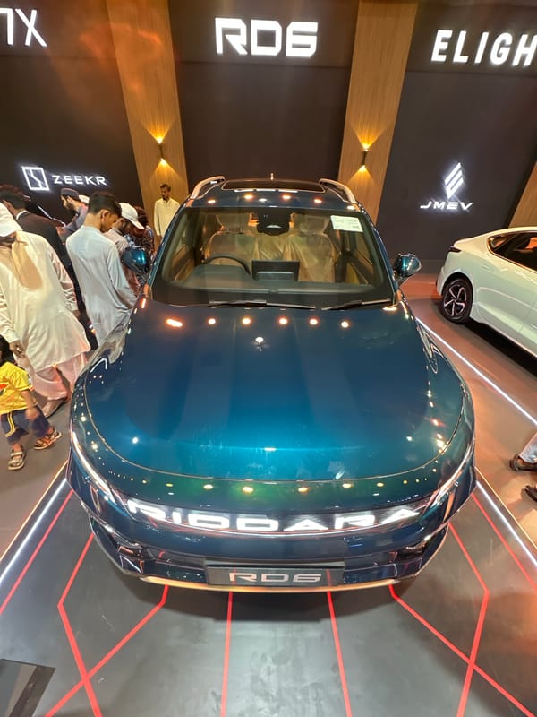 Electric and concept cars on display at an indoor auto exhibition