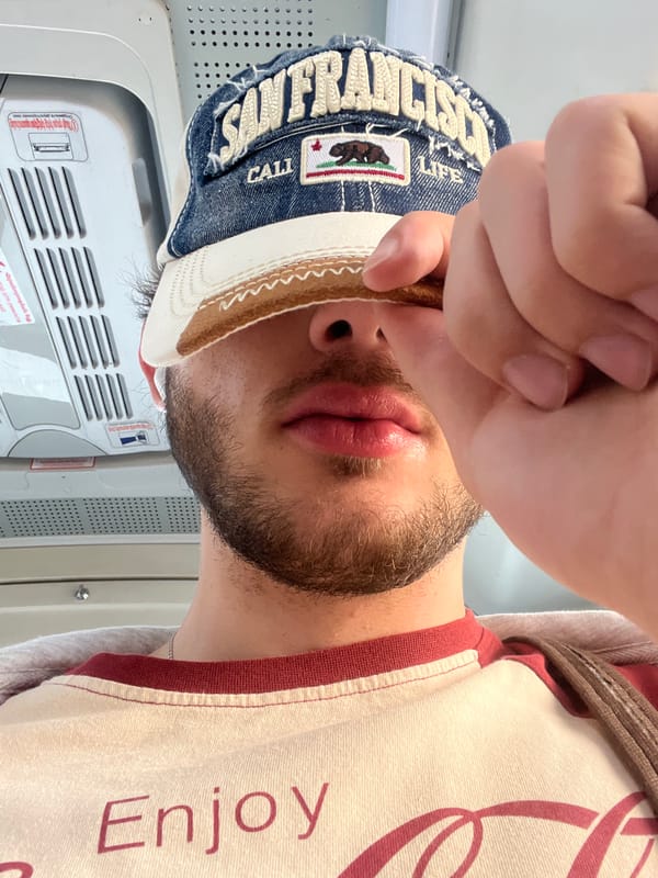 Tourist takes selfie in Yerevan wearing California cap