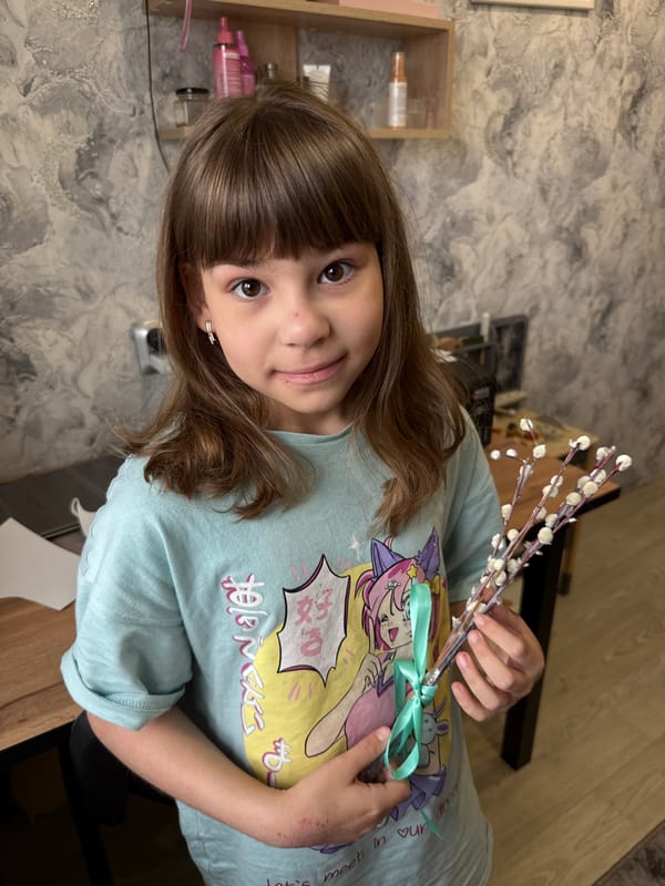 Woman holds pussy willow bouquet in Rusanovo, Russia