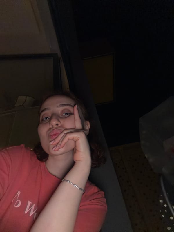 Woman Takes Evening Selfies in Strasbourg Bedroom
