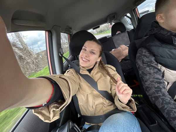 Woman takes selfie in car in Dve Mogili, Bulgaria
