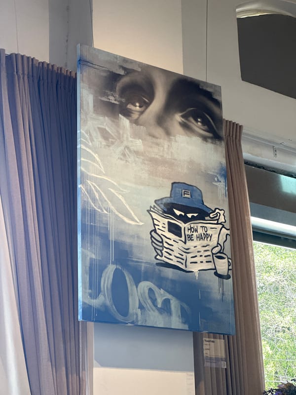 Happiness-themed artwork spotted in Tel Aviv café interior
