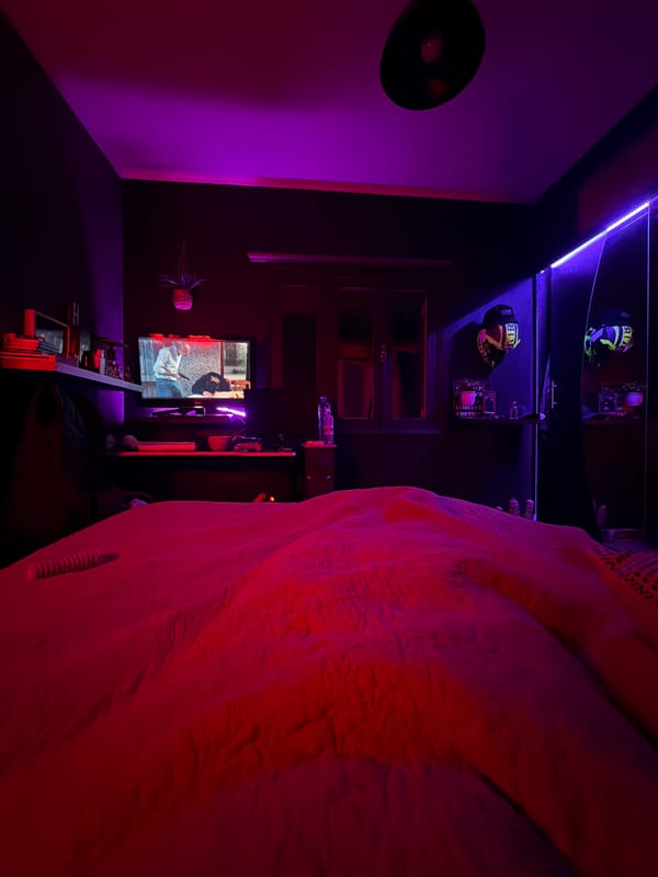 Bedroom documented with purple-red ambient lighting in Vila Real