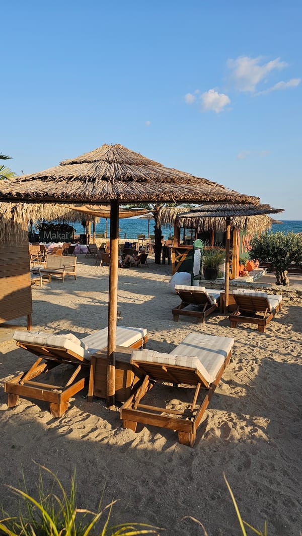 Balchik seafront at golden hour — bars, sculptures, and sea views