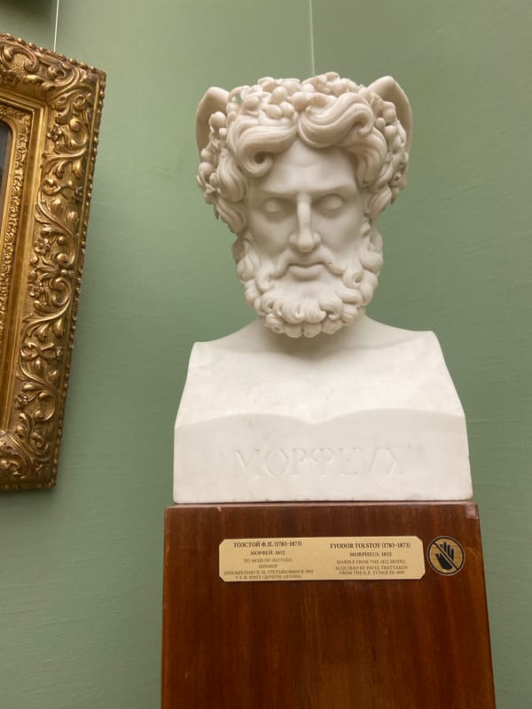 Museum visitor views classical Russian art collection in Moscow