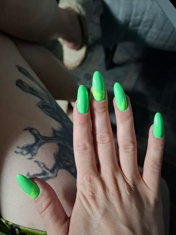 Green nail art with yellow accents spotted in Novi Sad