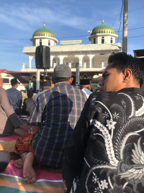 Outdoor prayer gathering documented in Lhokseumawe, Indonesia