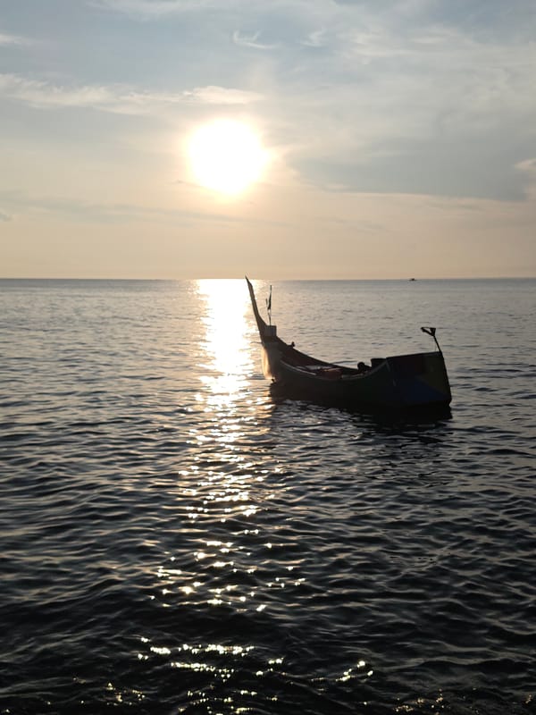 Fishing boats at sunset captured in Lhokseumawe waters