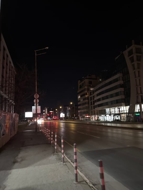 Wet nighttime street scene documented in Sofia, Bulgaria