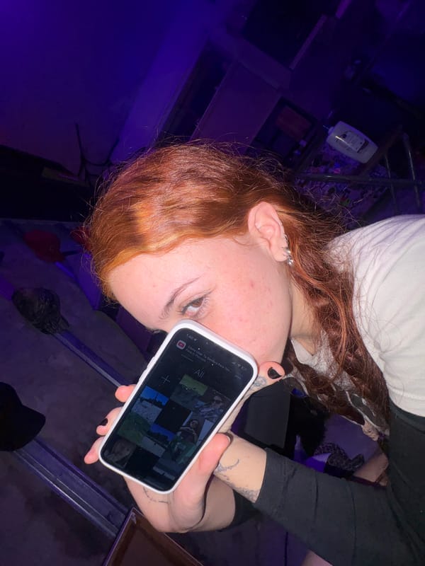 Woman uses YouTube app on smartphone in Buenos Aires