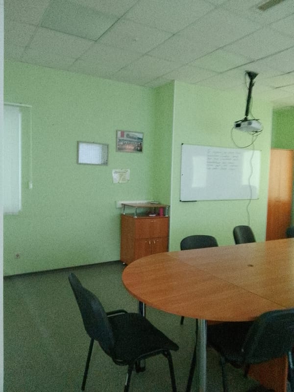 Inside a quirky green-walled Khabarovsk office, trophies and houseplants