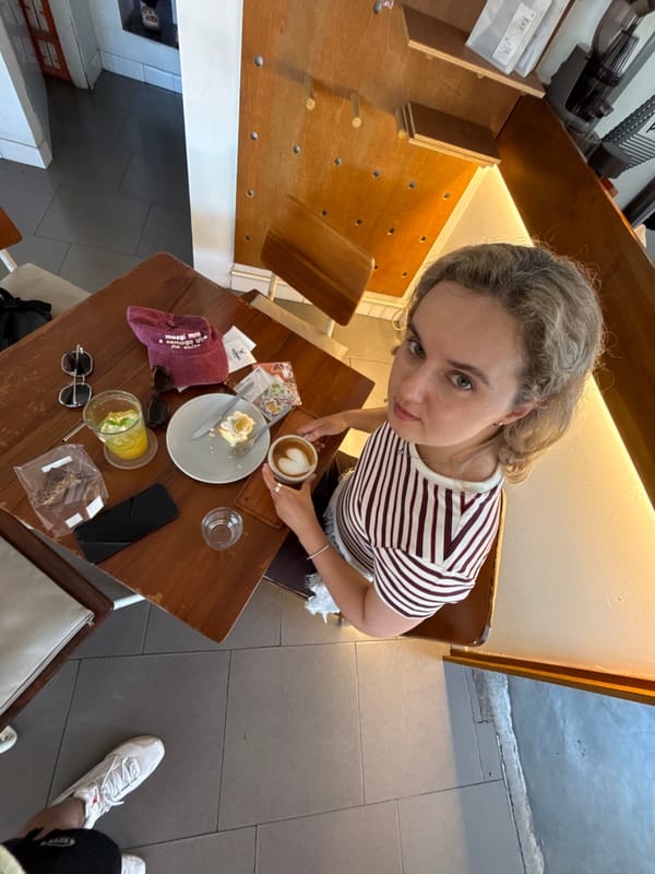 Café table spread in Kuta, Bali — drinks, food, stickers