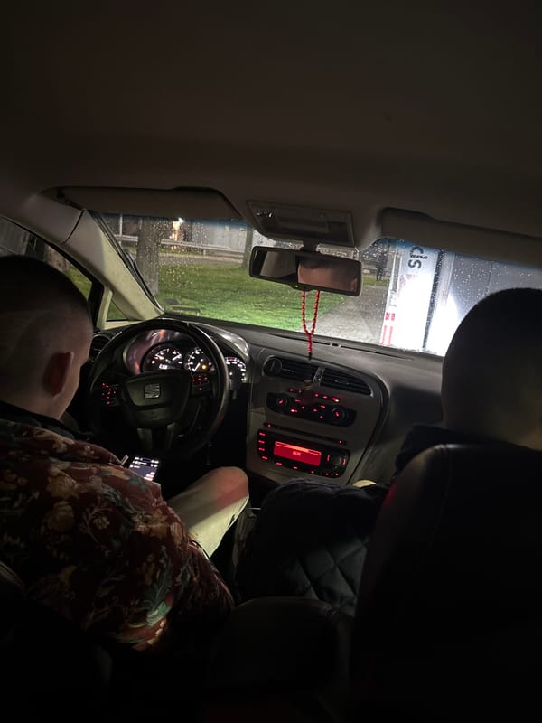 Two people rest inside parked car in Burgas