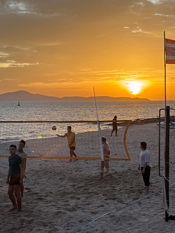 Beach volleyball at sunset on the Pattaya shoreline