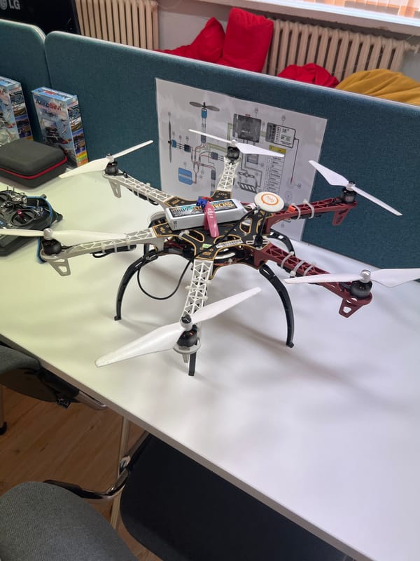 RC drone and airplane laid out on a table in Pravets