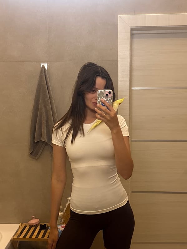 Mirror selfie with cockatiel companion in Krasnoyarsk bathroom