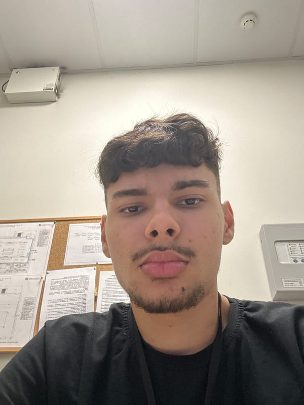 Young man takes sideways selfie in Pavlikeni building