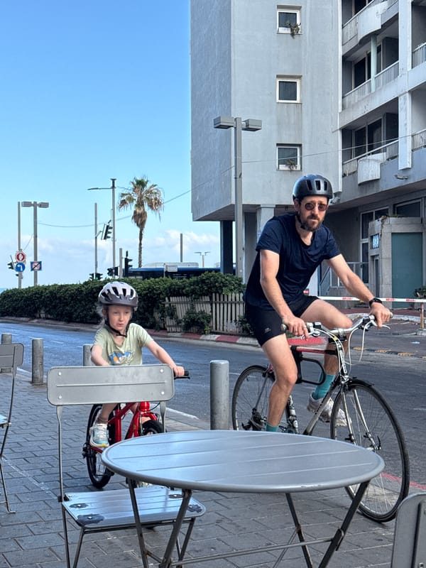 Cyclists and a casual selfie on a Tel Aviv morning
