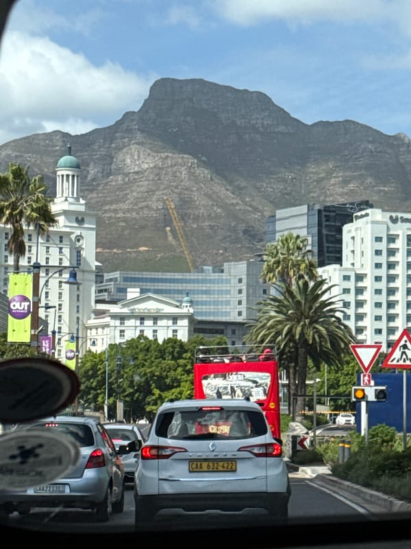 Vehicle passenger documents Cape Town street scene with Table Mountain