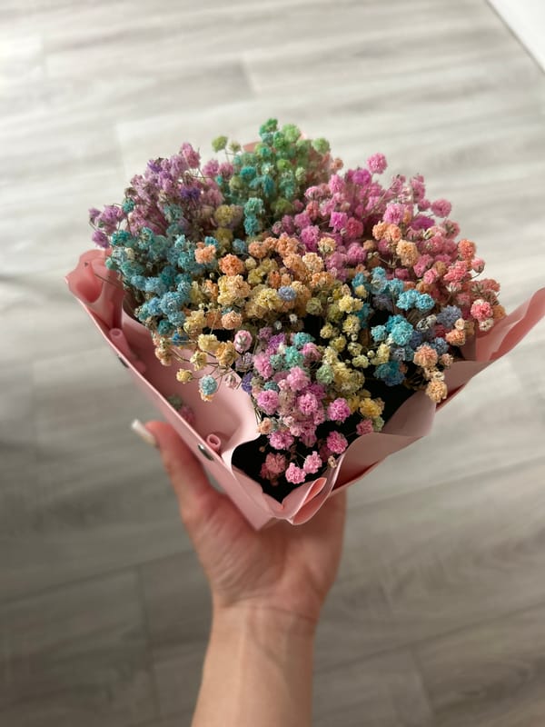 Indoor selfie session with heart shirt and flower bouquet