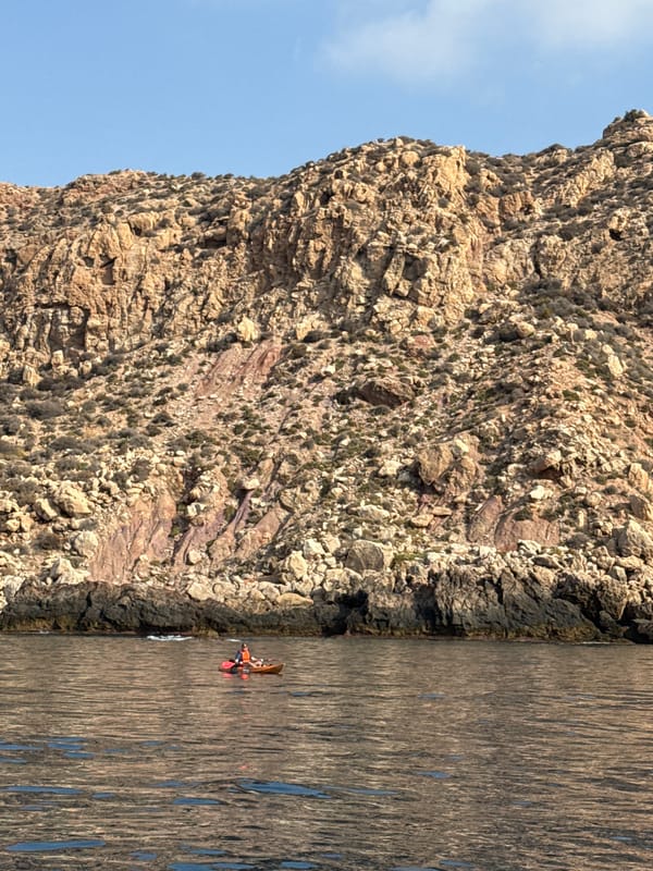 Rugged Spanish coastline cliffs with striking mineral vein exposed