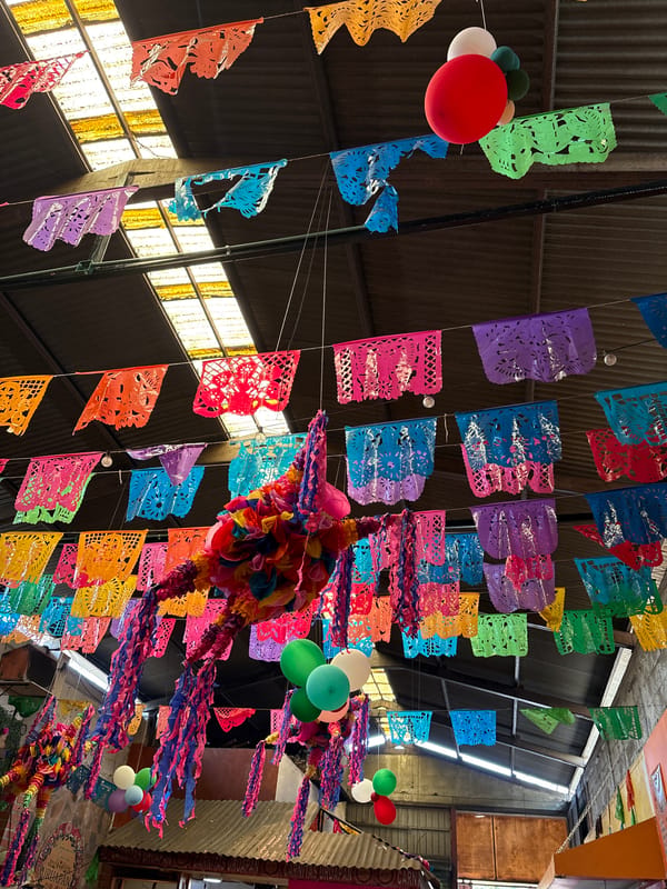 Traditional Mexican celebration with decorations, food, and live music