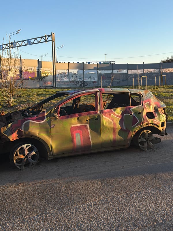 Damaged camouflage-painted car and graffiti spotted in Murino