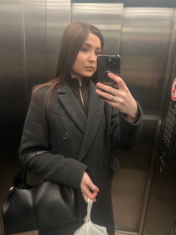 Woman takes mirror selfies in Khimki elevator