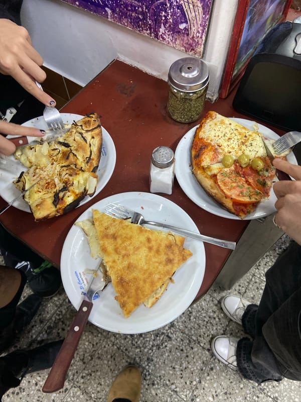 Late night dining at Buenos Aires pizzeria with Maradona memorabilia