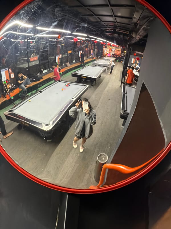 Selfie captured in convex mirror at Đà Nẵng billiard hall