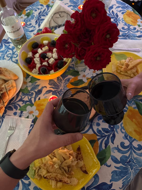 Dinner toast in Veliko Tarnovo with wine and floral tablecloth