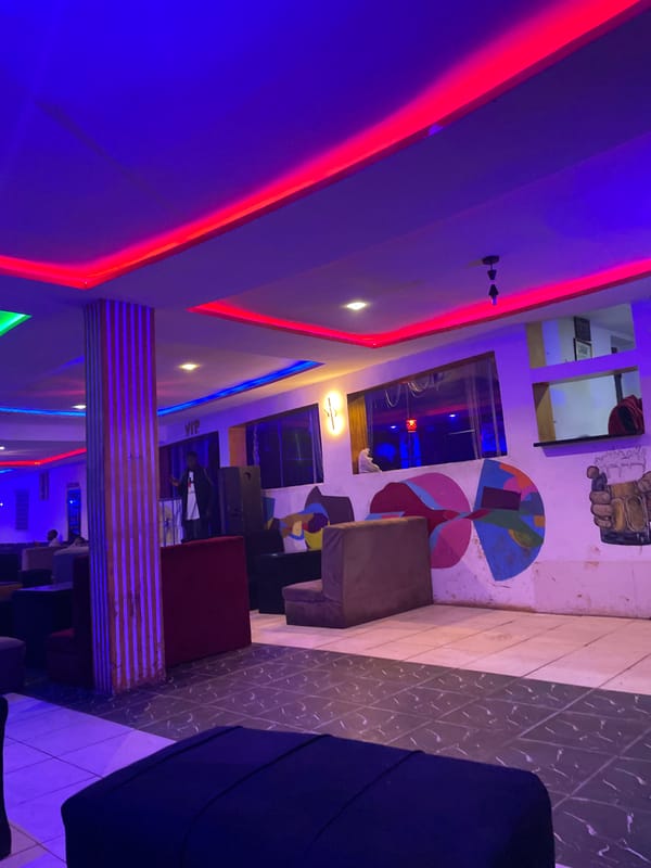 Late-night hookah lounge session under neon lights in Durumi