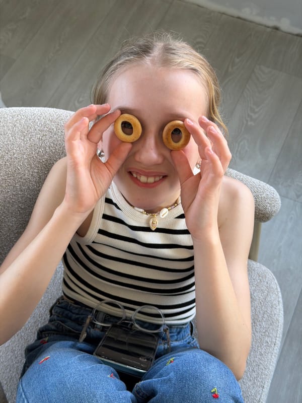Young person enjoys cookies on furniture in Dreiliņi