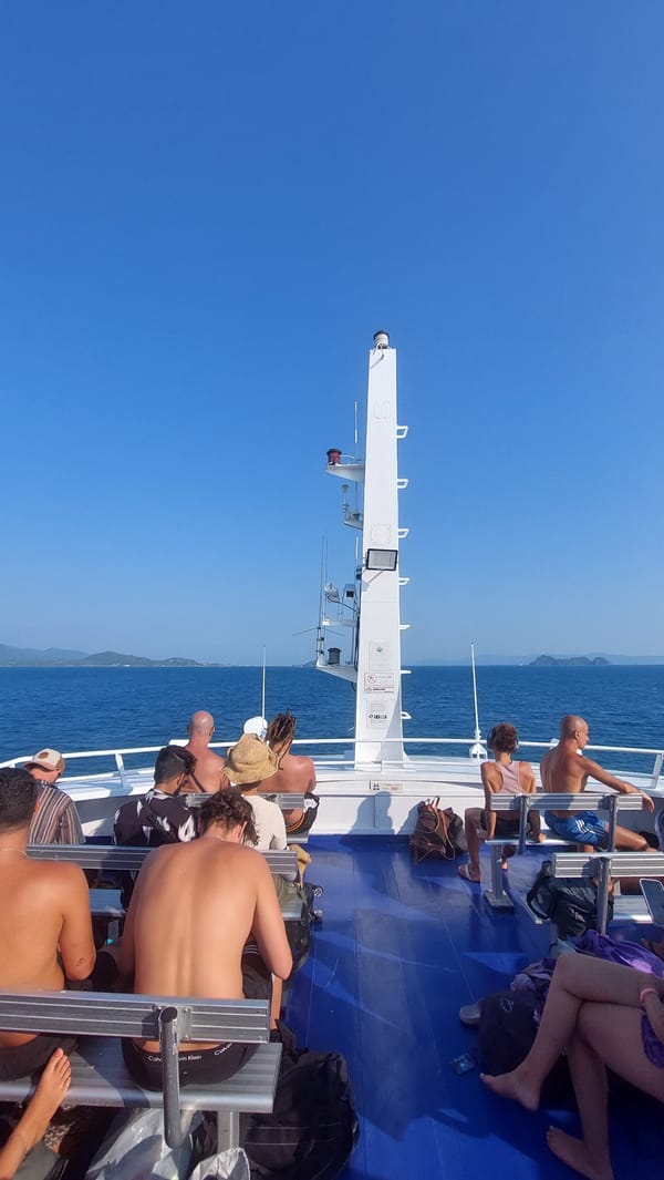 Ferry passengers enjoy sunny weather near Baan Sri Thanu
