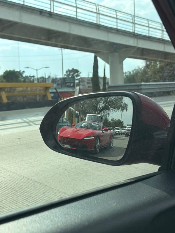 Red Ferrari spotted among traffic on Mexican highway
