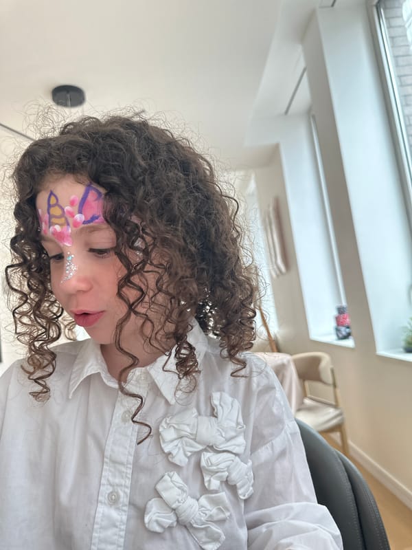 Family moments and face painting captured across NYC evening