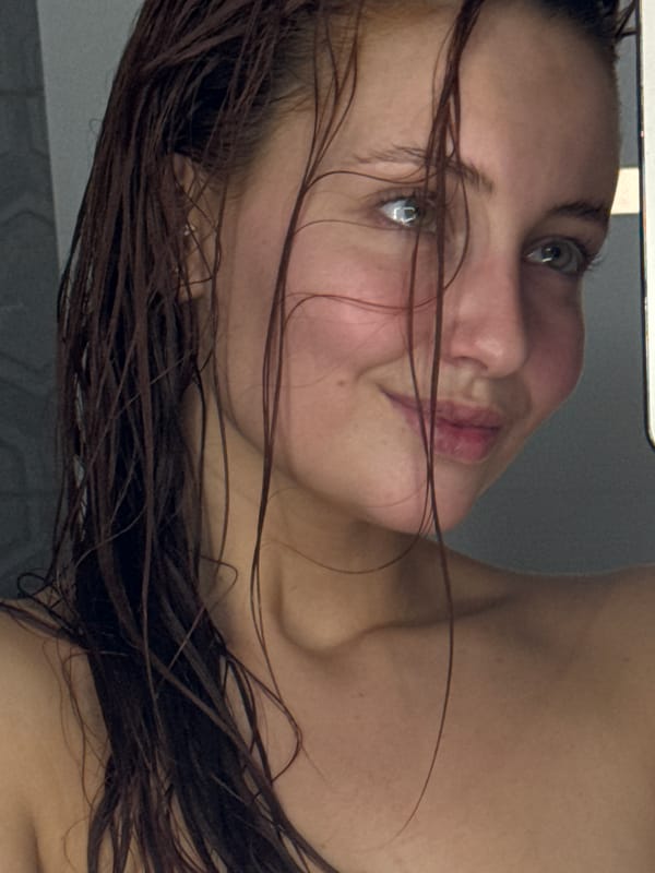 Woman photographed in bathroom setting in Chaikovsky, Russia