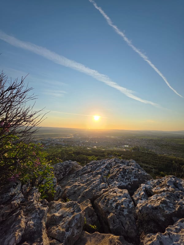 Golden hour landscape captured from rocky clifftop vantage point