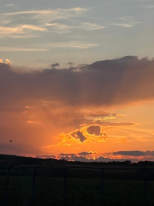 Layered sunset sky over rural Belozem, Bulgaria