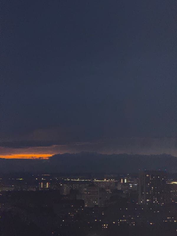 Orange glow illuminates horizon over Гамово, Russia at night