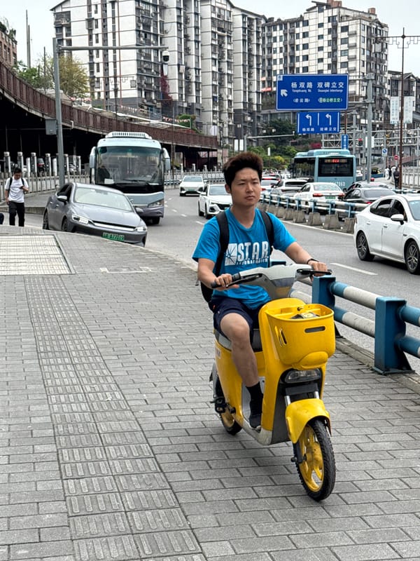 Morning scooter traffic observed in Shapingba District, China