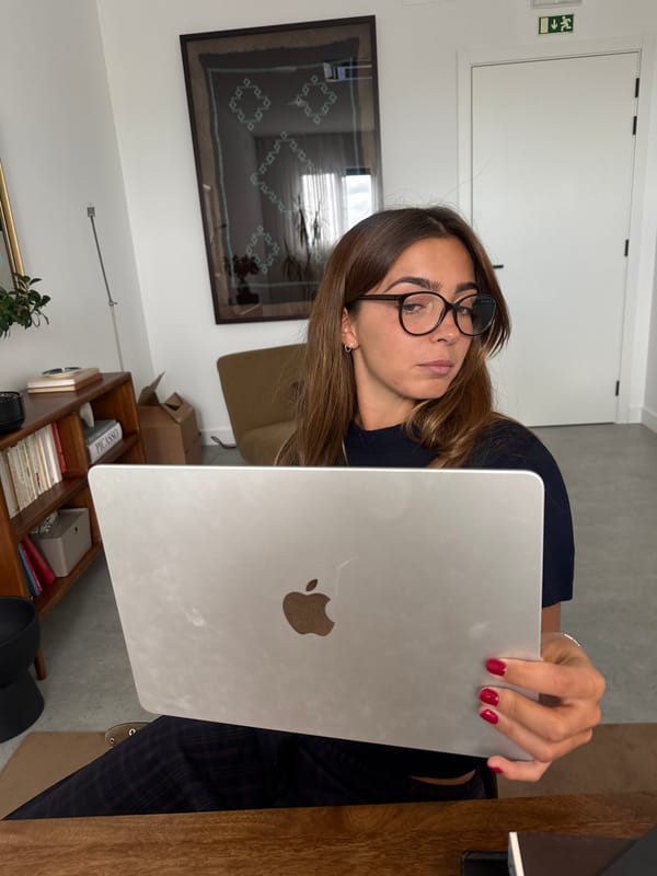 Woman uses MacBook laptop indoors in Torres Vedras, Portugal