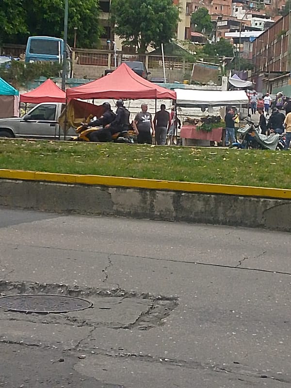 Street scenes captured across Caracas showing infrastructure, transit, military presence