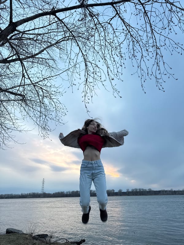 Young person captured mid-air at sunset in Chaikovsky, Russia