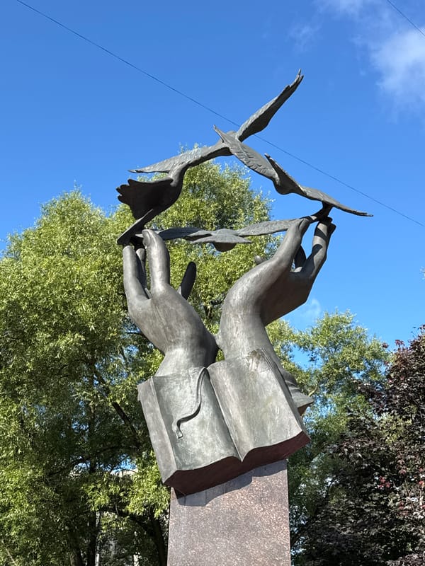 Ushinsky monument and street-level scenes in Sinyavino, Russia