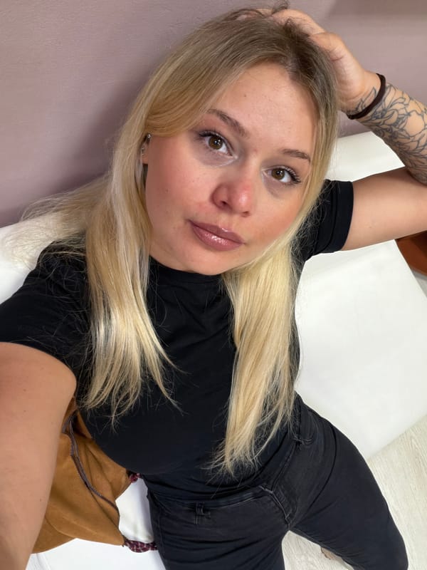 Woman takes selfies at hair salon in Sarapul, Russia