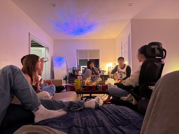 Six young adults gather in Westminster living room Sunday morning