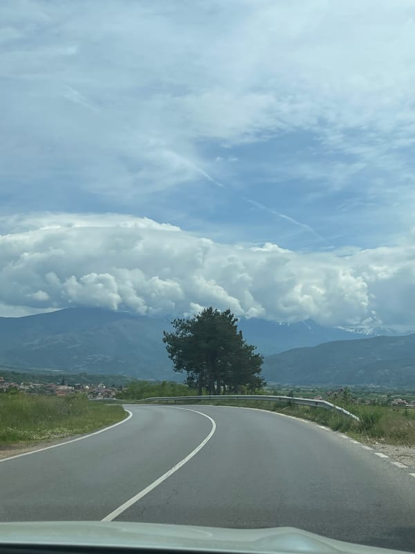 Vehicle travels winding road through Kocherinovo, Bulgaria