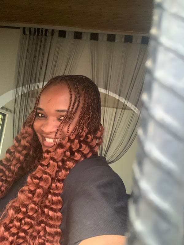 Woman takes indoor selfies in Barakin Akawo, Nigeria